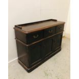 A Georgian dark oak sideboard with galleried top and three deep drawers.