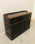 A Georgian dark oak sideboard with galleried top and three deep drawers.