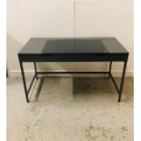 A Contemporary gun metal grey desk with two drawers, metal base and smoked glass top to one side and