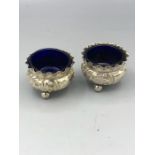 A Pair of silver salts with blue glass liners