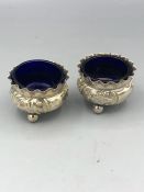 A Pair of silver salts with blue glass liners