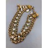 A Pearl and yellow metal necklace