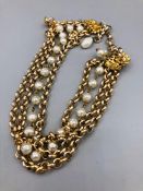 A Pearl and yellow metal necklace