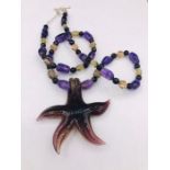 A Murano style Amethyst and semi precious stone necklace with silver clasp