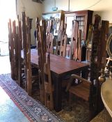 An imposing Ten seater dining table made from reclaimed Teak with eight chairs, two carvers. The