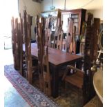 An imposing Ten seater dining table made from reclaimed Teak with eight chairs, two carvers. The