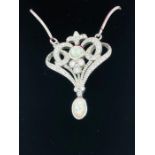 A silver and opal set pendant necklace