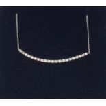 An 18ct white gold diamond bar necklace