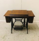 A Singer Sewing Machine Table with Sewing machine.