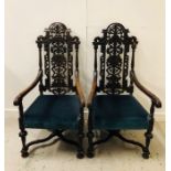 A Pair of carved oak chairs 133cm High x 68 cm wide