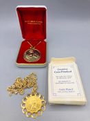 Two presentation gold plated coins