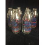 A set of six Stokes Dairy vintage milk bottles