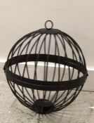 A Cast iron hanging candle cage