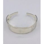 A Hallmarked silver bangle, made by Artisan from silver cutlery..