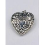 A Silver Heart shaped locket with embossed decoration