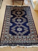 A Blue rug 189cm x 125cm (Made in Pakistan)