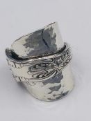 A solid silver spoon ring made from Antique cutlery by an Artisan. Successful bidders can notify