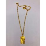 An Asian Gold 'Aquarius symbol and chain (7.7g)