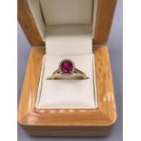 Rubellite Tourmaline and Diamond Ring 1.25ct. Oval cut Rubellite with Diamond border set in 18ct