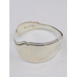 A silver bangle, artisan made with solid silver cutlery