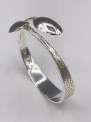 A silver bangle, Artisan made from silver spoons