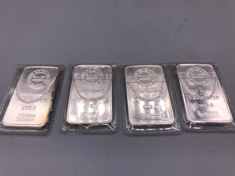 A set of four silver ingots