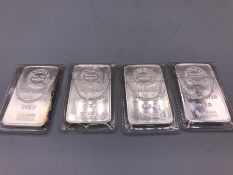 A set of four silver ingots