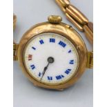A Ladies 9ct gold and enamel faced watch (19.3g)