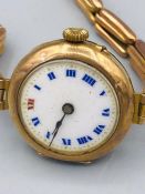 A Ladies 9ct gold and enamel faced watch (19.3g)