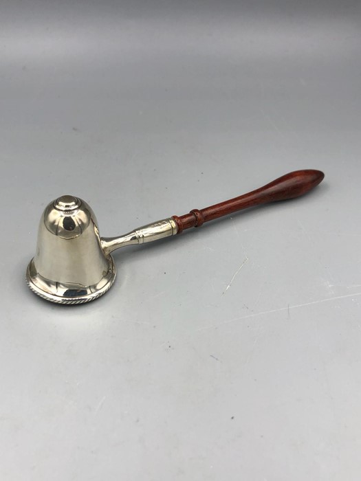 A sliver candle snuffer