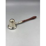 A sliver candle snuffer