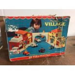 A 1970's Fisher Price Village, box is as found with all sorts of associated items.