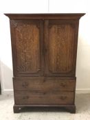 An Oak Linen Press with brass drop handles