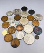 A small selection of coins to include pennies, 1862 New Zealand trade token, crowns etc.
