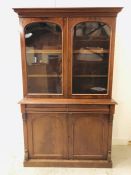 A Mahogany glazed book case with cupboard under. 203cm H x 124 cm W x 50 cm D