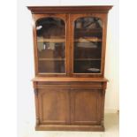 A Mahogany glazed book case with cupboard under. 203cm H x 124 cm W x 50 cm D