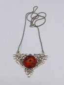 A silver and amber style pendant necklace