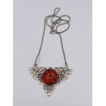 A silver and amber style pendant necklace