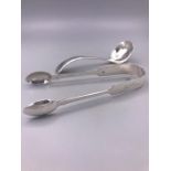 A pair of silver sugar tongs, Exeter 1862 engraved 'Joyce' and a cream ladle Sheffield 1941 Viner