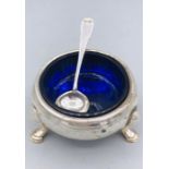 A silver salt with blue liner, indistinct hallmarks