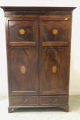 A Mahogany two door inlaid wardrobe with two drawers under 127cm x 59cm x 197cm H