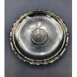 A Sterling silver dish with a central Hong Kong 1 Dollar coin