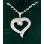 A 14CT white gold Heart shaped diamond set pendant necklace