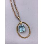 A 9ct yellow gold chain and Aquamarine pendant. (6.2g)