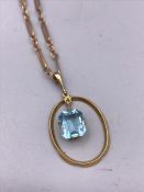 A 9ct yellow gold chain and Aquamarine pendant. (6.2g)