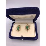 A set of Jade earrings in a 9ct gold setting