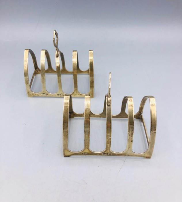 A pair of silver toast racks, Birmingham 1936 R & Co.