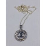 A silver designer style pendant and necklace set with CZ's