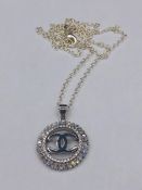 A silver designer style pendant and necklace set with CZ's