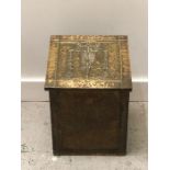 A Brass, coal bin, in a hammered style.